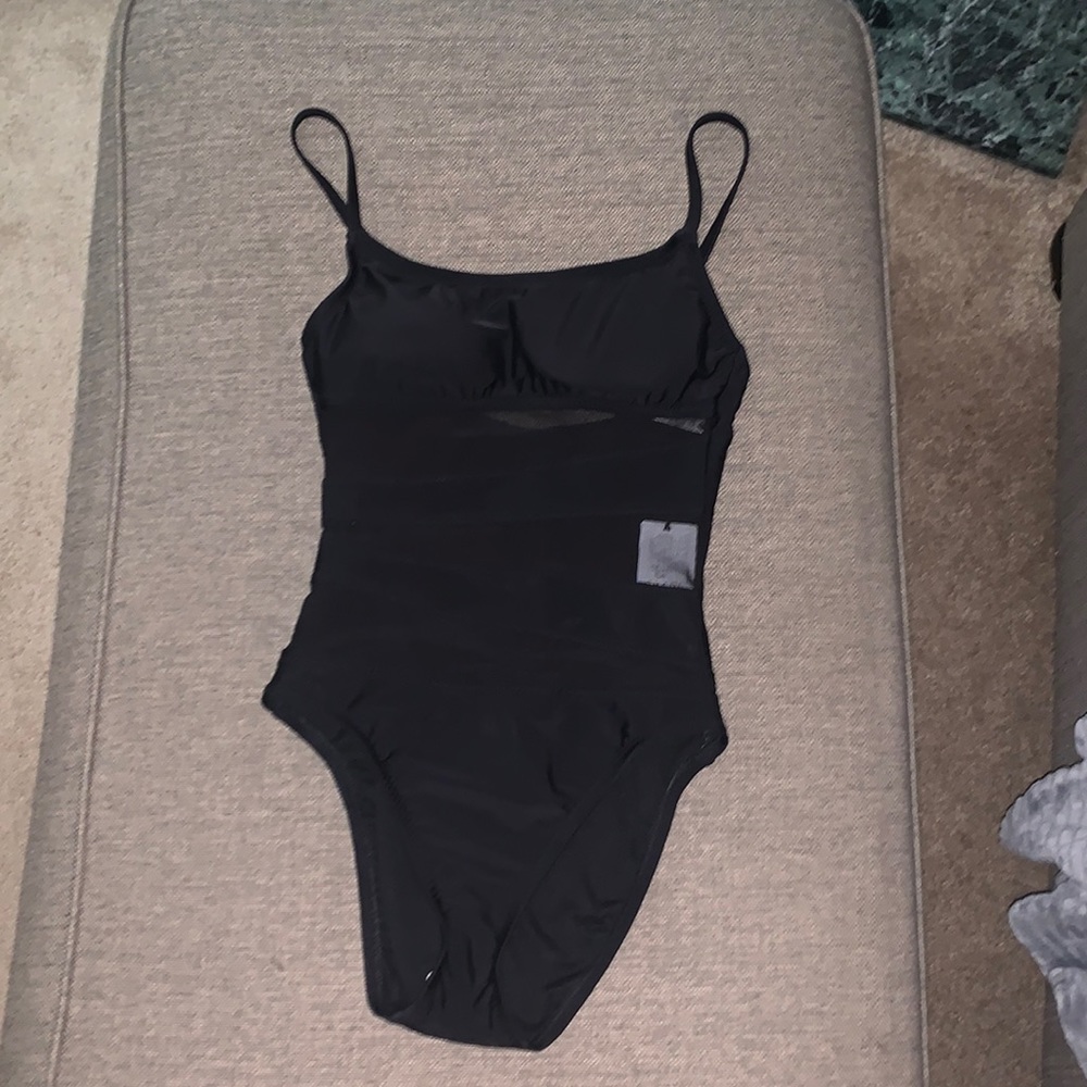 Cute black bathing suit. Mesh striping through middle. Size small NWT